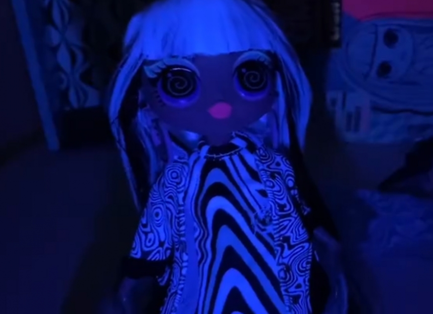 LOL OMG Lights Groovy Babe doll under black light
