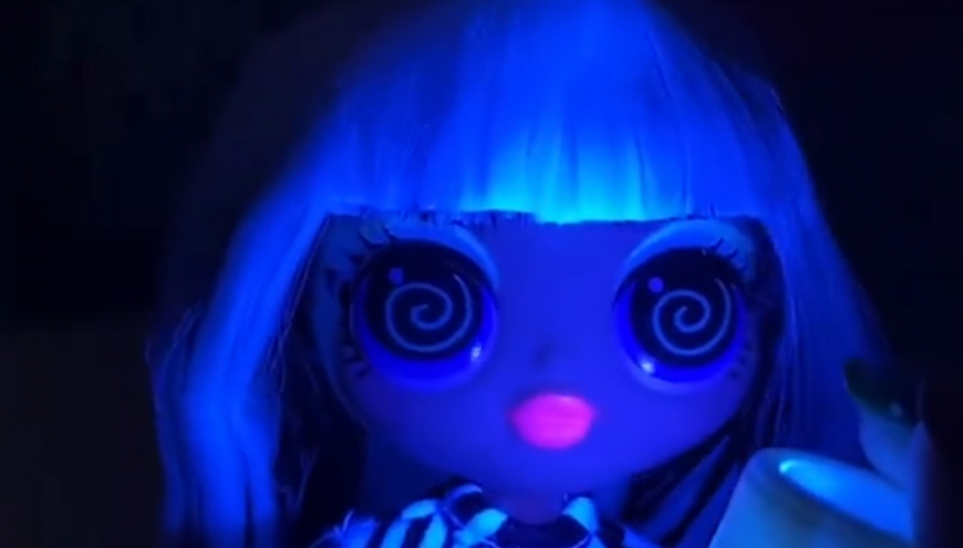 LOL OMG Lights Groovy Babe doll under black light